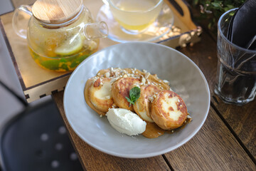 Breakfast food menu salads granola waffles cheese and tea