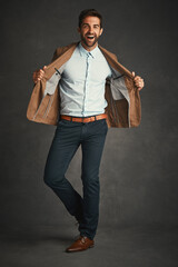 Obraz premium Always dress like its the best day of your life. Studio shot of a handsome young man posing against a gray background.