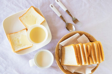 Breakfast, bread and milk on the table