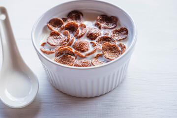 .Breakfast cereal with fresh milk on the white table