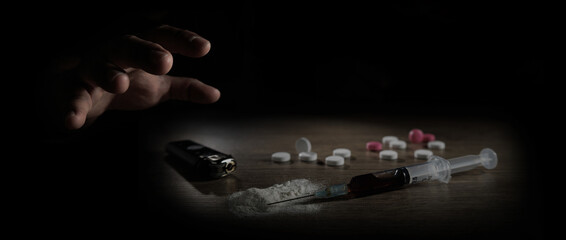 Stop drug addiction concept International Day against Drug syringe and cooked heroin on spoon.