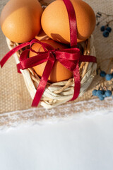 Fototapeta na wymiar Brown Easter eggs with a basket