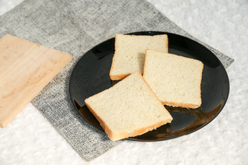 Plain toasted bread whole. White bread toast slice.
