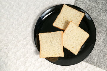 Plain toasted bread whole. White bread toast slice.