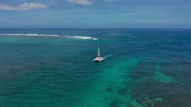 Aerial view Mauritius, sailboat catamaran in blue lagoon. Tropical paradise island. Exotic travel vacation getaway, romantic honeymoon destination.