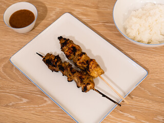 Grilled Chicken Satay BBQ Skewer or Sate ayam with Rice and Peanut Sauce
