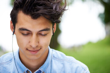 Lost in the music. A handsome young man enjoying his music.