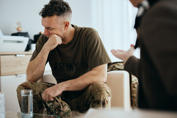 Depressed veteran having meeting with psychotherapist at mental health center.
