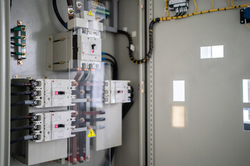 Control panel with circuit breakers, fuses, rails, wiring in the distribution board. Power electric in electrical cabinet control. Electricity and electrical maintenance service.