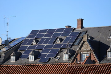 When solar panels is beeing placed on historic building. In theis case on the bank building on the square in Hilleroed 1908