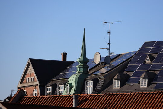 When solar panels is beeing placed on historic building. In theis case on the bank building on the square in Hilleroed 1908