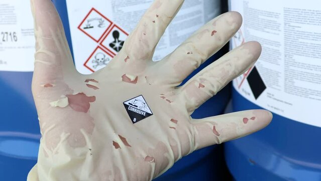 Gloves were torn by to chemical corrosive and danger 