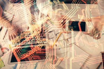 Double exposure of man and woman working together and technology theme drawing. Computer background. Top View. High tech concept.