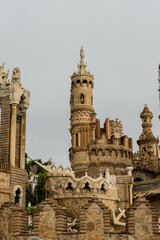 Fototapeta na wymiar classic castle tower under a grey sky in a clouds day