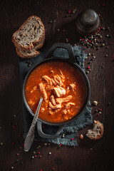 Homemade and spicy tripe soup spiced with red pepper.