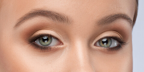 Beautiful eyes of a woman with bright make-up close-up.  makeup and healthy clean skin....