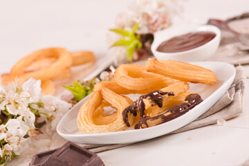 Churros with chocolate dipping sauce.