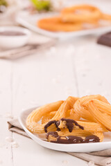 Churros with chocolate dipping sauce.