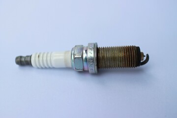 old spark plugs on a white background