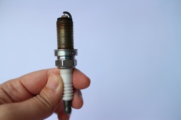 old spark plugs on a white background