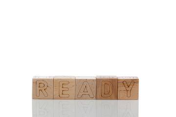 Wooden cubes with letters ready on a white background