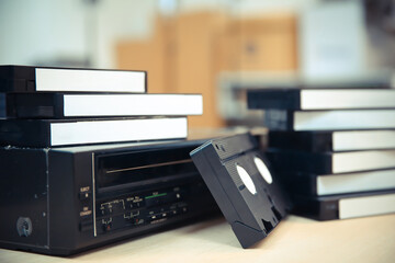 Pile of video cassette tape VHS with video playback old retro style stack concept of vintage...