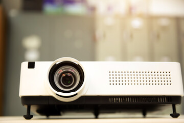 Close-up computer projector on table boardroom or meeting room technology equipment of visual or...