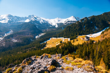 Alpine meadows and snowy peaks in the spring High Tatras mountains. Zakopane, Poland.