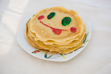 The pancake is smiling. Smile on baked pancakes.