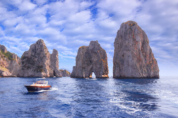 The Faraglioni Rocks on the coast of the island of Capri, Italy. Capri stacks, the symbol of the island, located in the gulf of Naples, Campania.