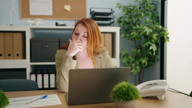 Young redhead woman business worker stressed working at office
