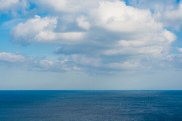 Fototapeta na wymiar cotton clouds over the ocean. Serenity. Peace. Tranquility. Meditation