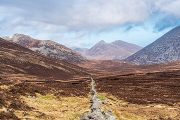 Mourne Mountains landscape in County Down, Northern Ireland as seen from the path leading to Slieve Binnian peak.