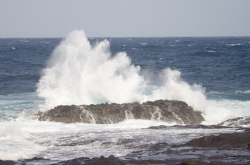 Wave breaking against the shore. El Confital. La Isleta Protected Landscape. Las Palmas de Gran Canaria. Gran Canaria. Canary Islands. Spain.
