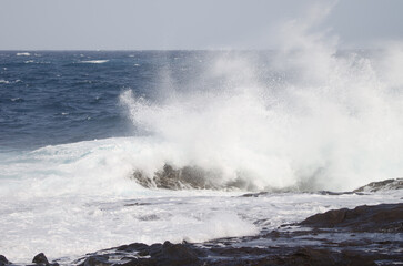 Wave breaking against the shore. El Confital. La Isleta Protected Landscape. Las Palmas de Gran Canaria. Gran Canaria. Canary Islands. Spain.