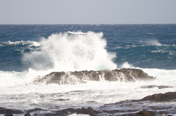 Wave breaking against the shore. El Confital. La Isleta Protected Landscape. Las Palmas de Gran Canaria. Gran Canaria. Canary Islands. Spain.