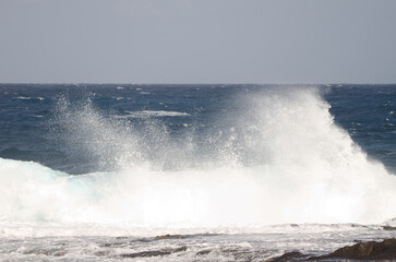 Wave breaking against the shore. El Confital. La Isleta Protected Landscape. Las Palmas de Gran Canaria. Gran Canaria. Canary Islands. Spain.