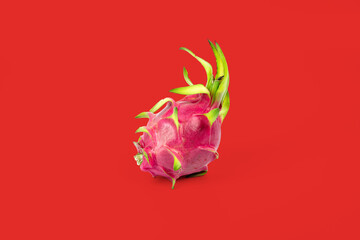 Dragon fruit isolated on red background with clipping path.