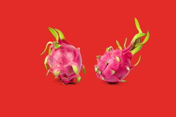Dragon fruit isolated on red background with clipping path.