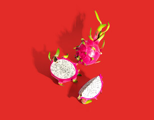 Dragon fruit slice isolated on red background with clipping path.