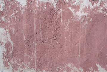 Grunge texture background, red paint stain on a concrete uneven, rough wall