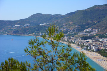 Fototapeta premium cleopatra beach in Alanya with waterfront and mountains on background, view from top