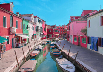 The picturesque canal of Burano,Italy , in the Venice lagoon, an island world famous for its characteristic brightly colored houses.