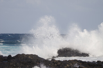 Wave breaking against the shore. El Confital. La Isleta Protected Landscape. Las Palmas de Gran Canaria. Gran Canaria. Canary Islands. Spain.