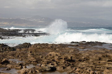 Waves breaking against the shore. El Confital. La Isleta Protected Landscape. Las Palmas de Gran Canaria. Gran Canaria. Canary Islands. Spain.