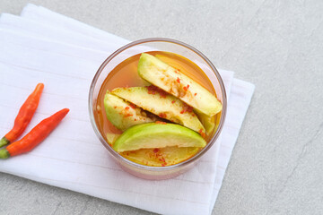 Asinan Kedondong (pickled fruit), a traditional Indonesian cuisine made from preserved tropical fruits. Spicy, sweet and sour taste.
