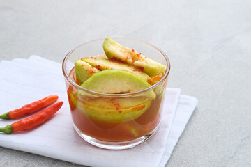 Asinan Kedondong (pickled fruit), a traditional Indonesian cuisine made from preserved tropical fruits. Spicy, sweet and sour taste.
