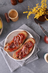 Sandwiches with peanut butter, strawberry jam and bacon