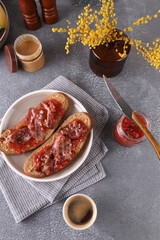 Sandwiches with peanut butter, strawberry jam and bacon