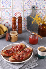 Sandwiches with peanut butter, strawberry jam and bacon